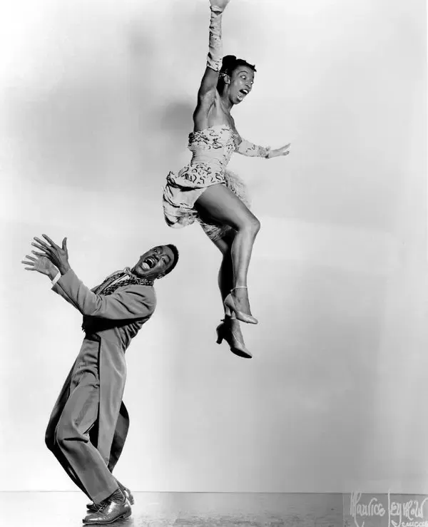 Norma Miller leaping high in the air above Billy Ricker